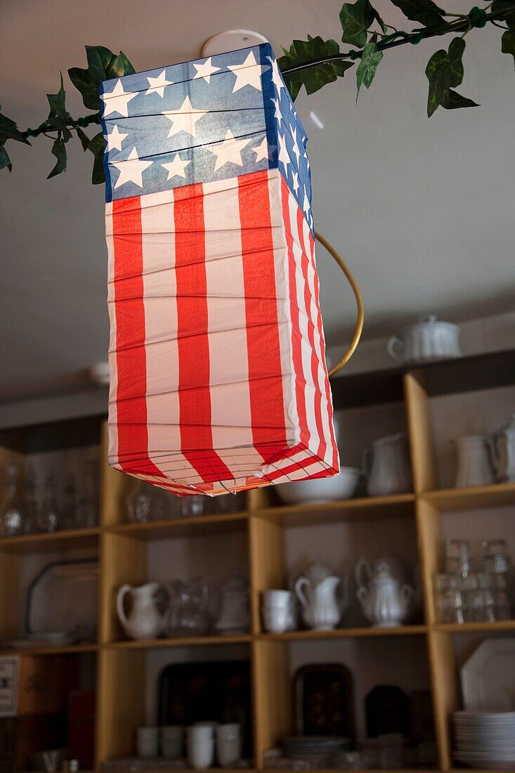 USA, West Virginia, Harpers Ferry, Harpers Ferry National Historic Park, US Flag lanterns in Dry Goods Store