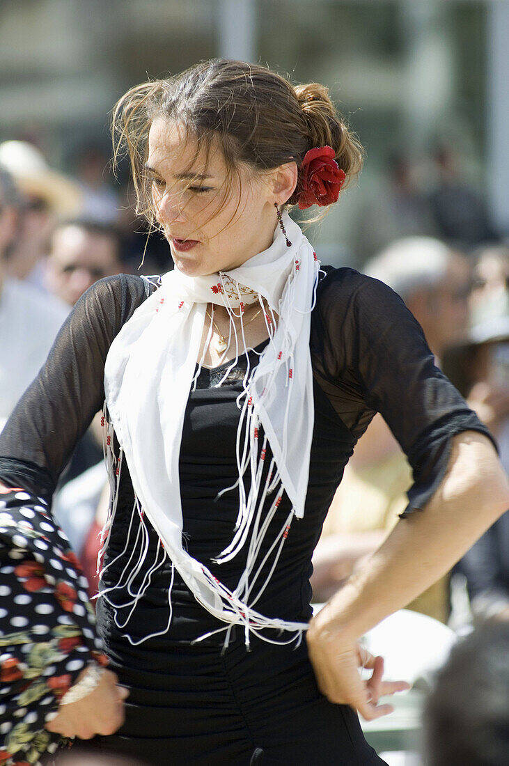 Woman dancing flamenco in the street during fair, Sevilla. Andalusia, Spain