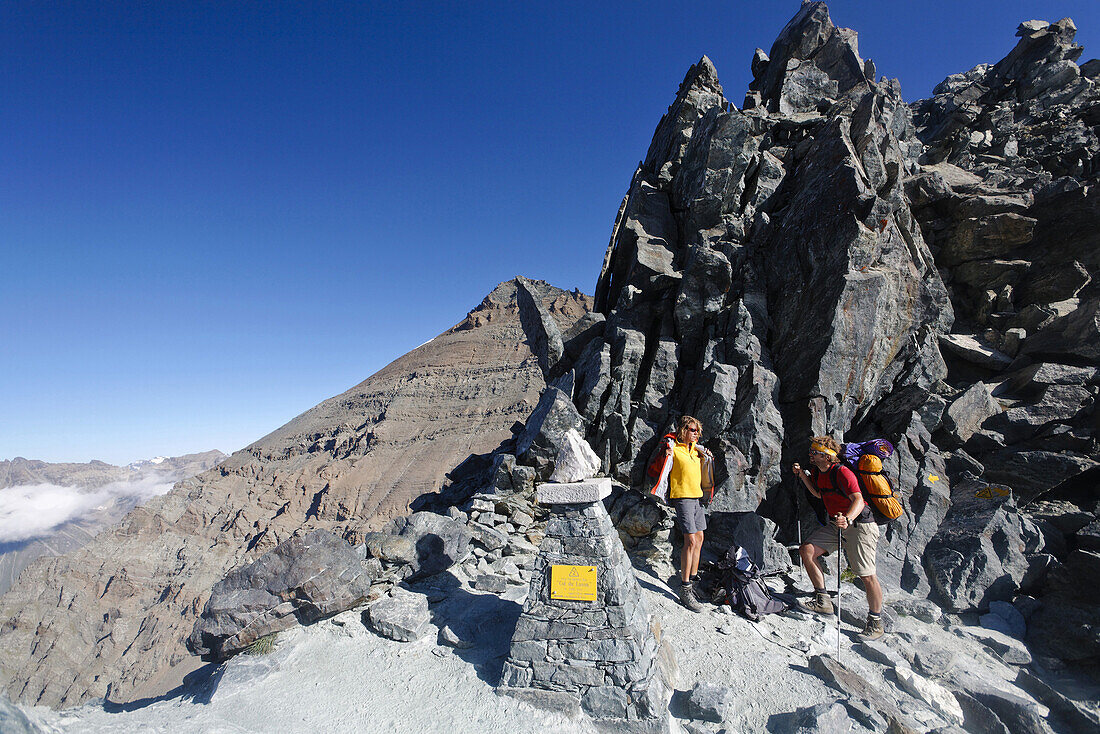 Hikers on summit of Col Lauson, Gran Paradiso National Park, Aosta Valley, Italy
