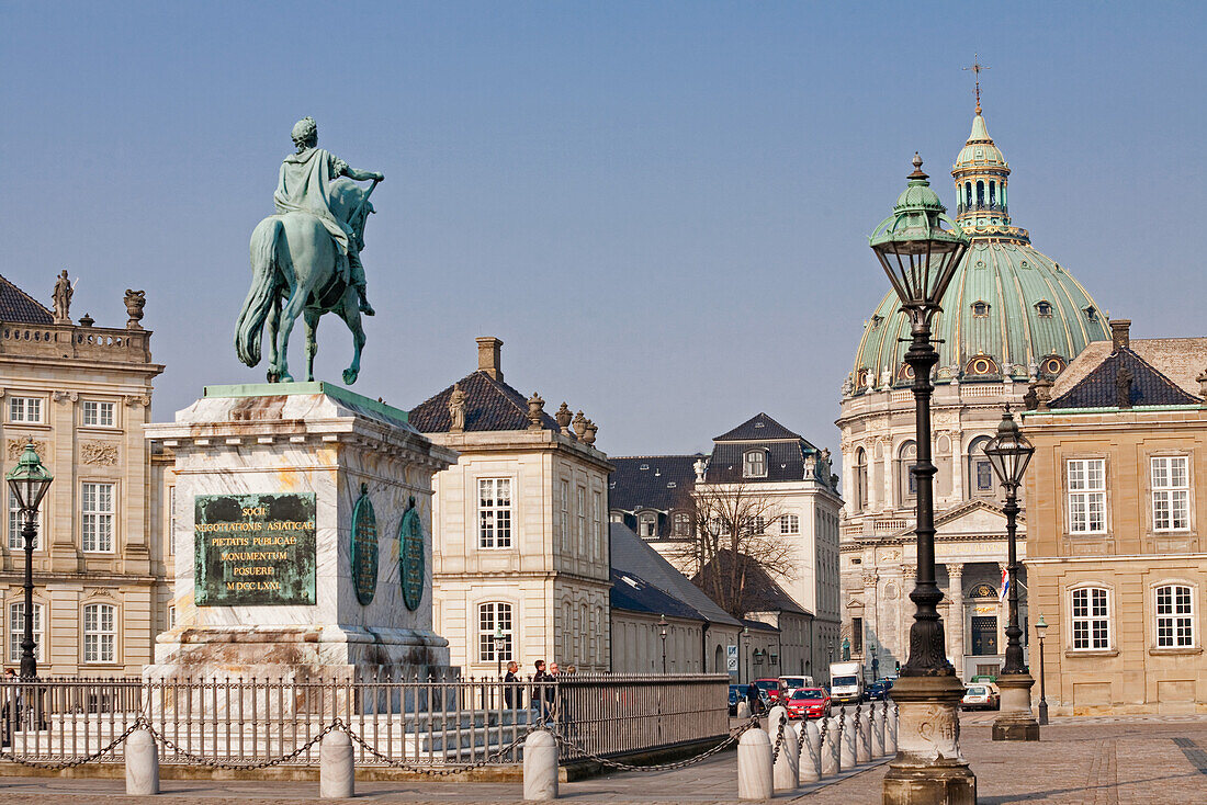 Slotsplads courtyard in front of Amalienborg palace with statue of Frederik V and marble church, Marmorkirken, Frederiks church in the background, Copenhagen, Denmark