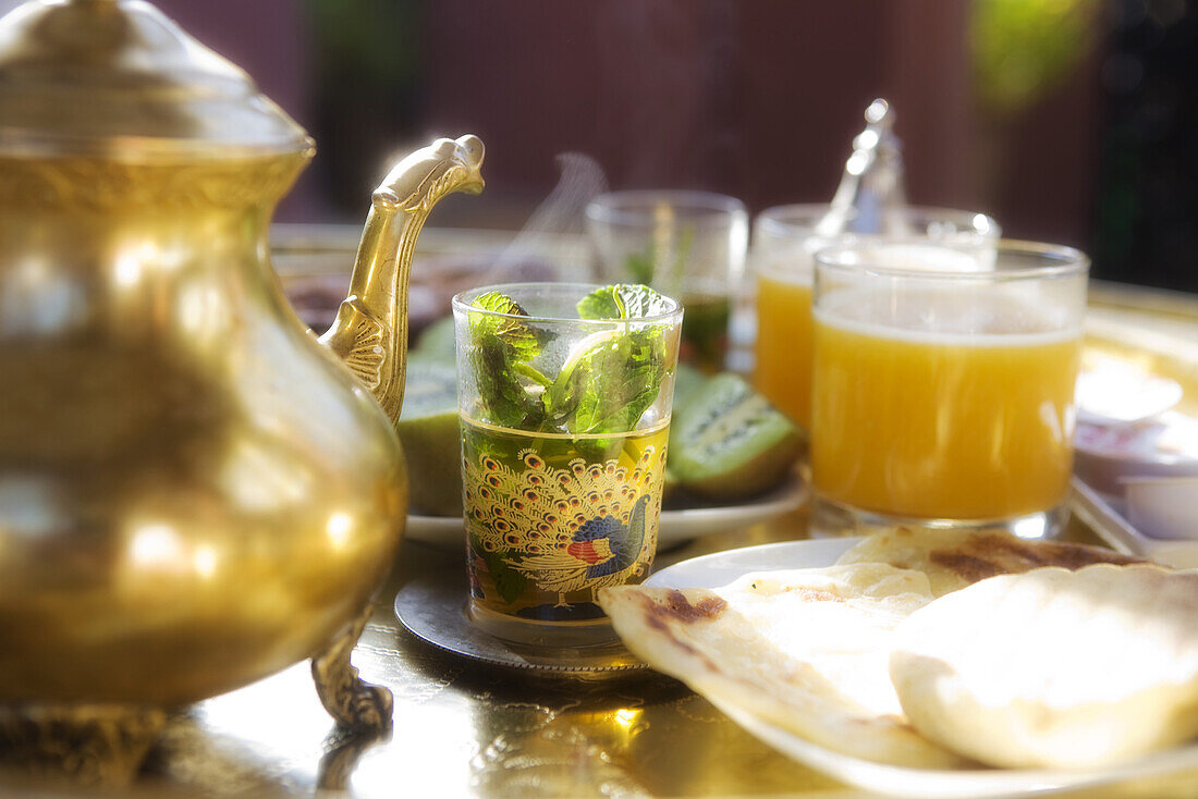 Moroccan breakfast with peppermint tea, Kiwi and orange juice, Riad Kaiss, Marrakech, Morocco, Africa