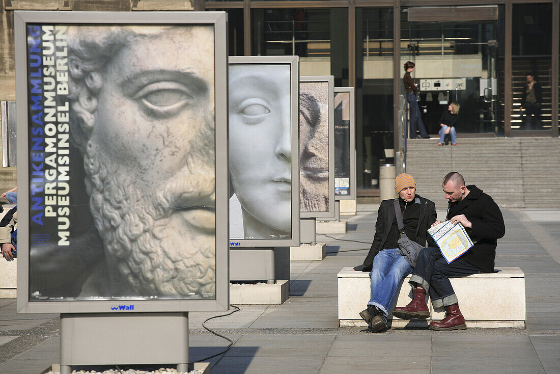 People sitting in front of the Pergamon museum, Berlin Mitte, Berlin, Germany