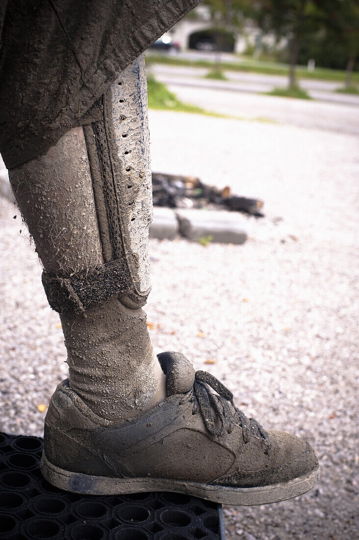 Dirty leg of a mountain biker, Austria