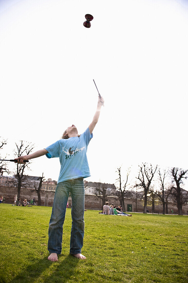 Boy playing with diabolo, Vienna, Austria