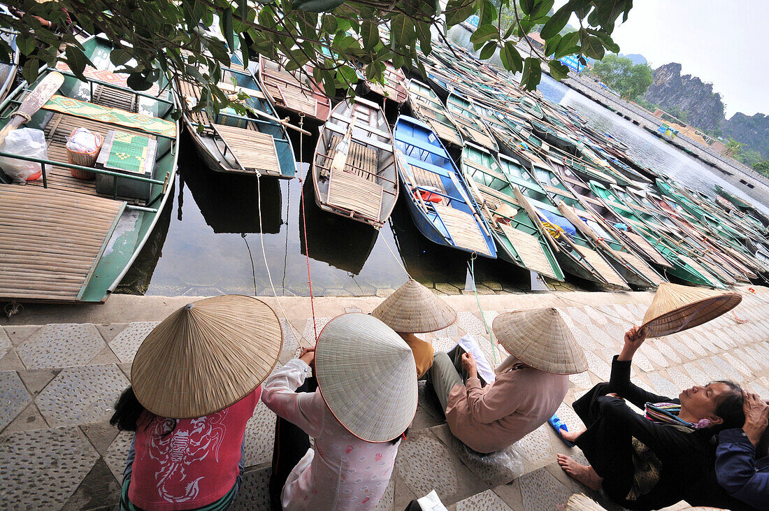 A group of women sitting by the river, Tam Coc in Halong bay near Ninh Binh, north Vietnam, Vietnam