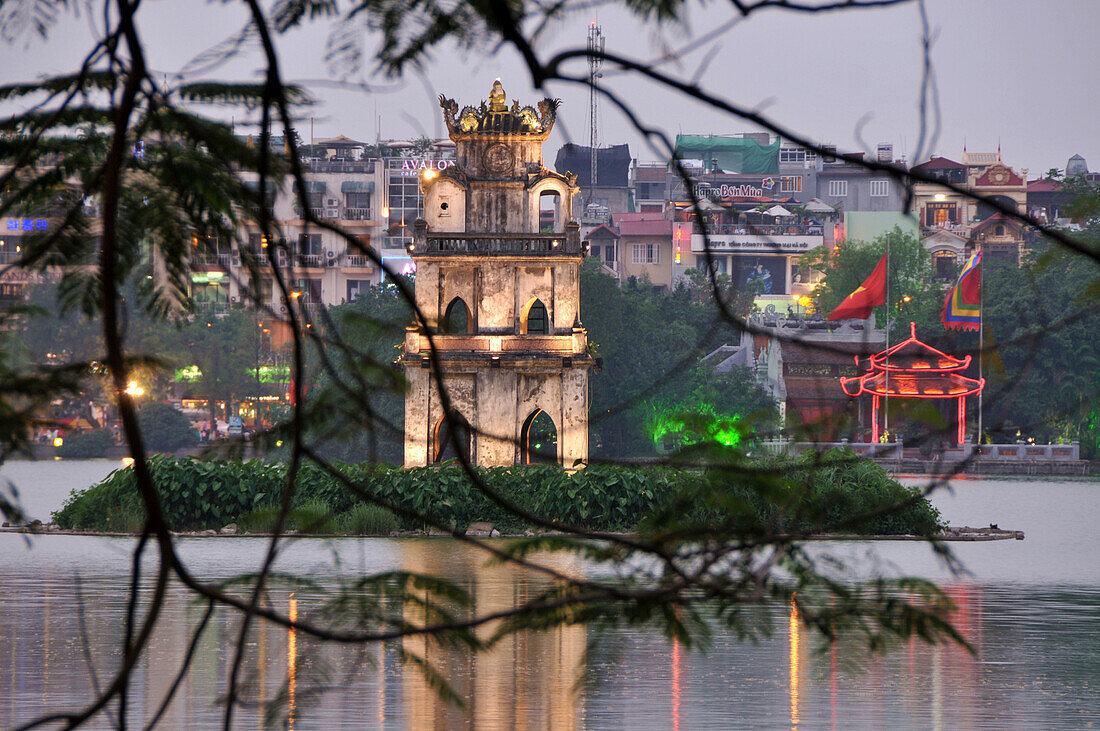 View across Hoan Kiem lake with Tap Rua, turtle tower, old town of Hanoi, Vietnam