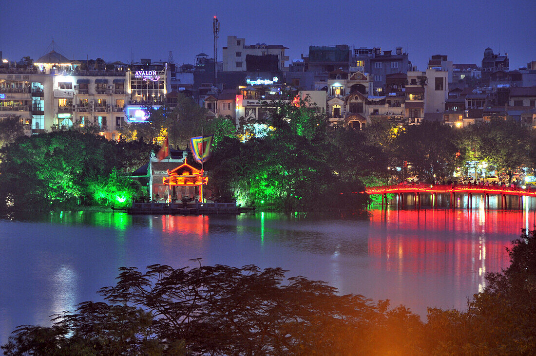 View across Hoan Kiem lake in the evening light with temple of Ngoc-Son, old town of Hanoi, Vietnam
