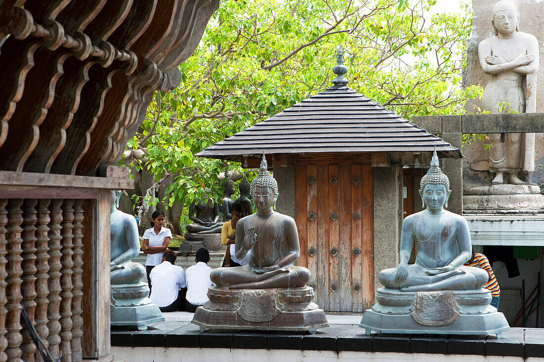 Buddhists at the Seema Malaka temple on Beira Lake, Colombo, Sri Lanka, Asia