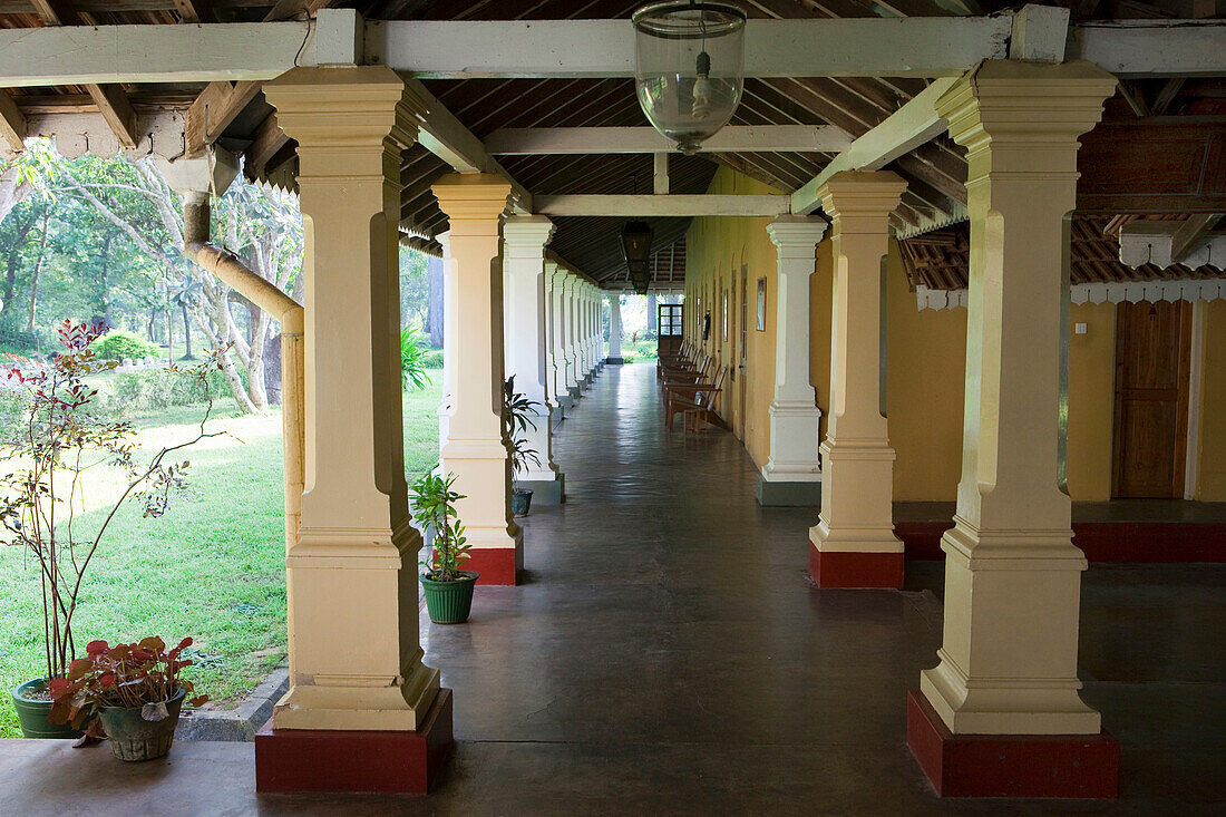 Veranda of the Tissawewa Resthouse, an Hotel in an old colonial villa inside of the Sacred City, Anuradhapura, Sri Lanka, Asia