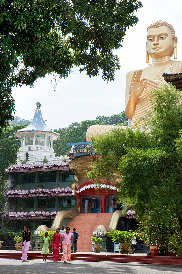 Golden Buddha statue at the entrance to the cave temple of Dambulla, Dambulla, Sri Lanka, Asia