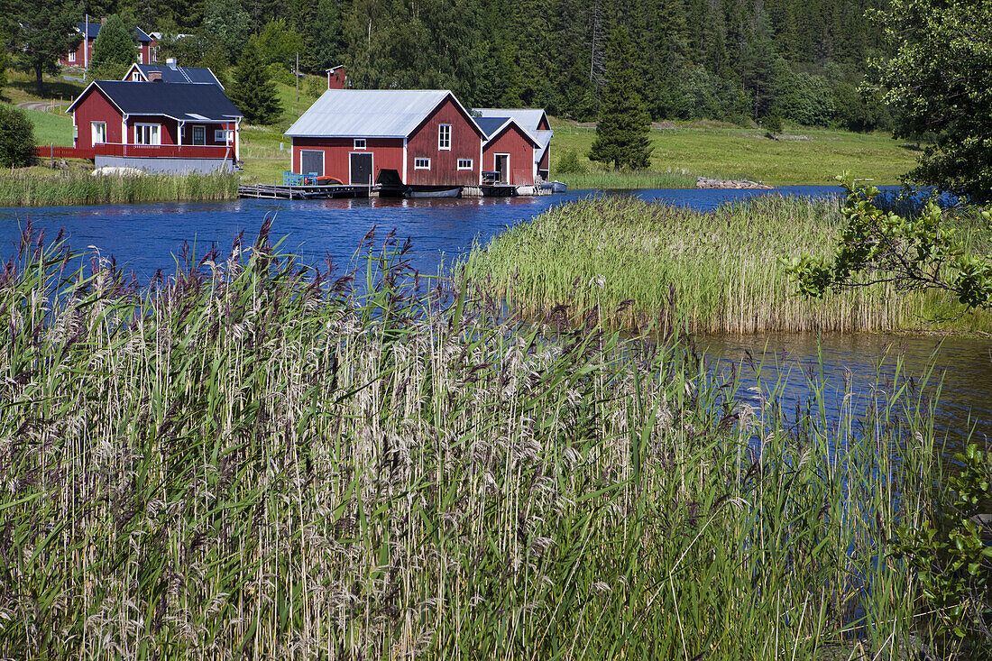 Wooden houses on the waterfront, Faellsvikshamn, Höga Kusten, Vaesternorrland, Sweden, Europe