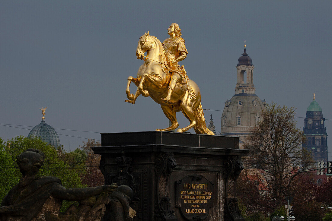 Der goldene Reiter, The golden equestrian sculpture of King Augustus the Strong, August II, with dome of the Frauenkirche, Church of our Lady and town hall tower in the background, Dresden, Saxony, Germany