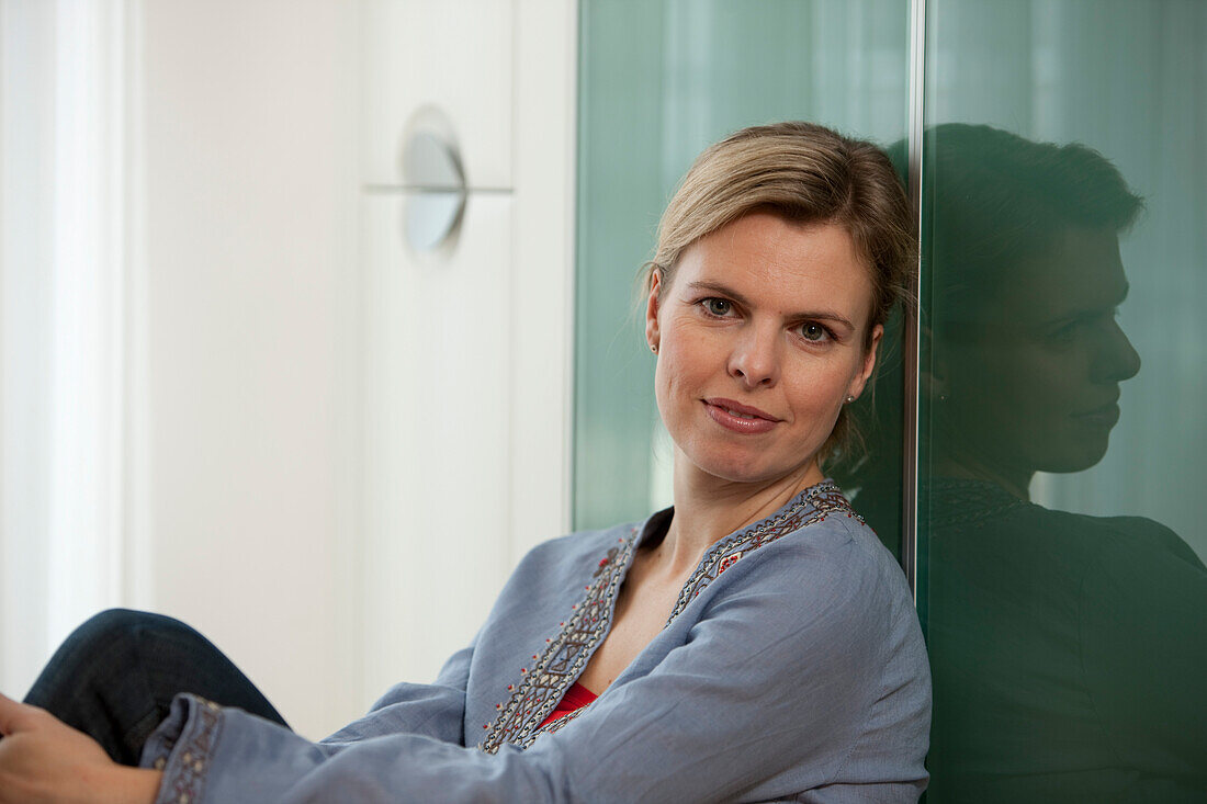 Mid adult woman smiling at camera