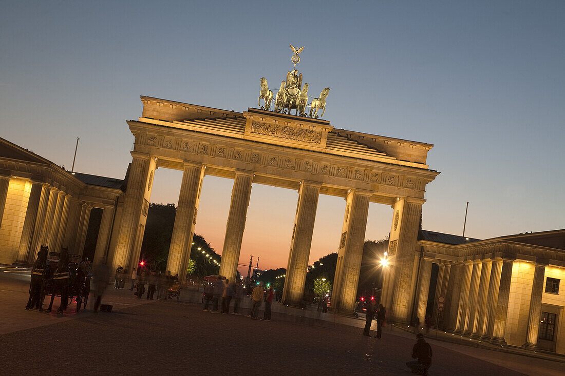 Brandenburg gate with Quadriga on top of in Berlin at sunset