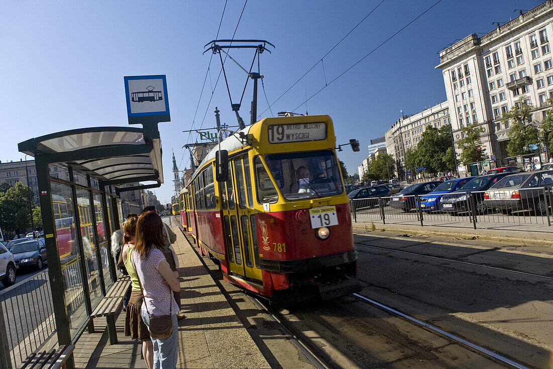 People at tram stop on Marszalkowska Boulevard, Warsaw, Poland, Europe