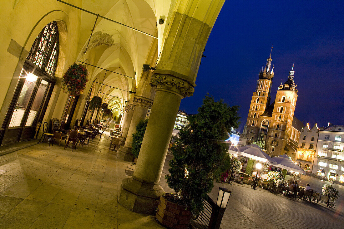 Cloth hall and St. Mary's Basilica at main market square Rynek Glowny at night, Krakow, Poland, Europe