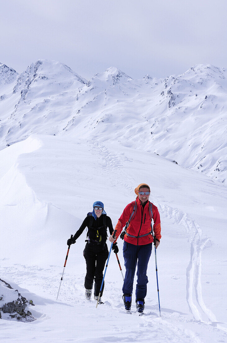 Two women backcountry skiing, Niederjoch, Langer Grund, Kitzbuehel range, Tyrol, Austria, Europe