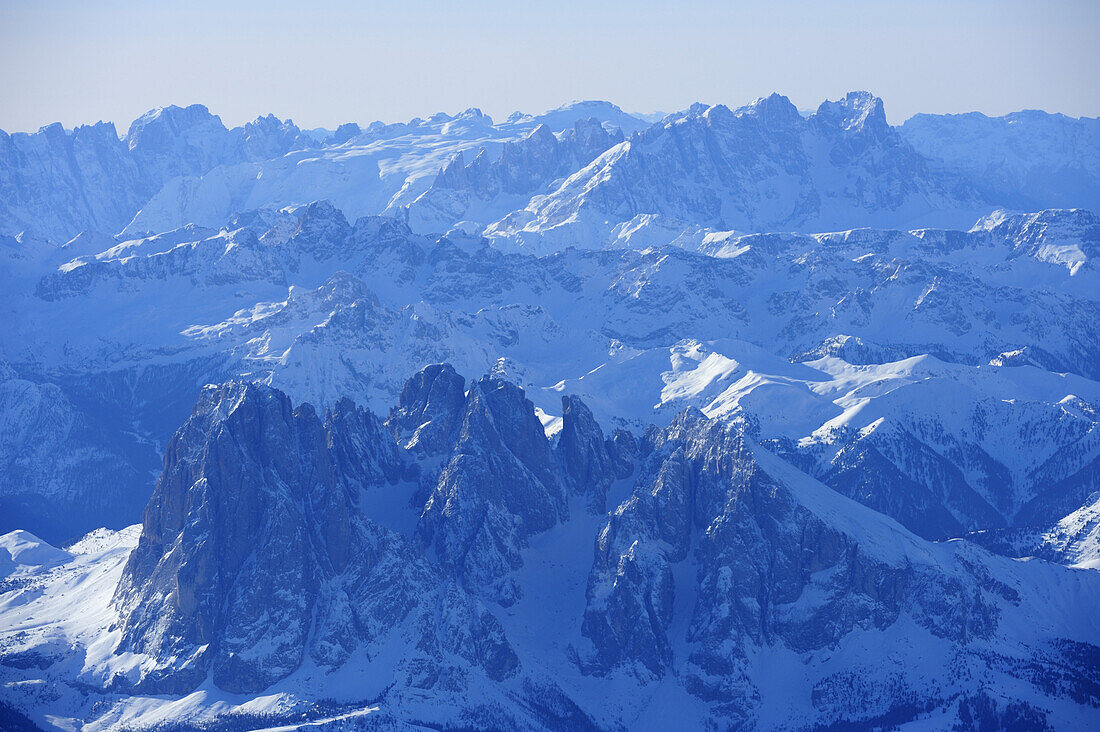 View at Langkofel, Fuenffingerspitze and Plattkofel in winter, Pala range in background, aerial photo, Dolomites, South Tyrol, Italy, Europe