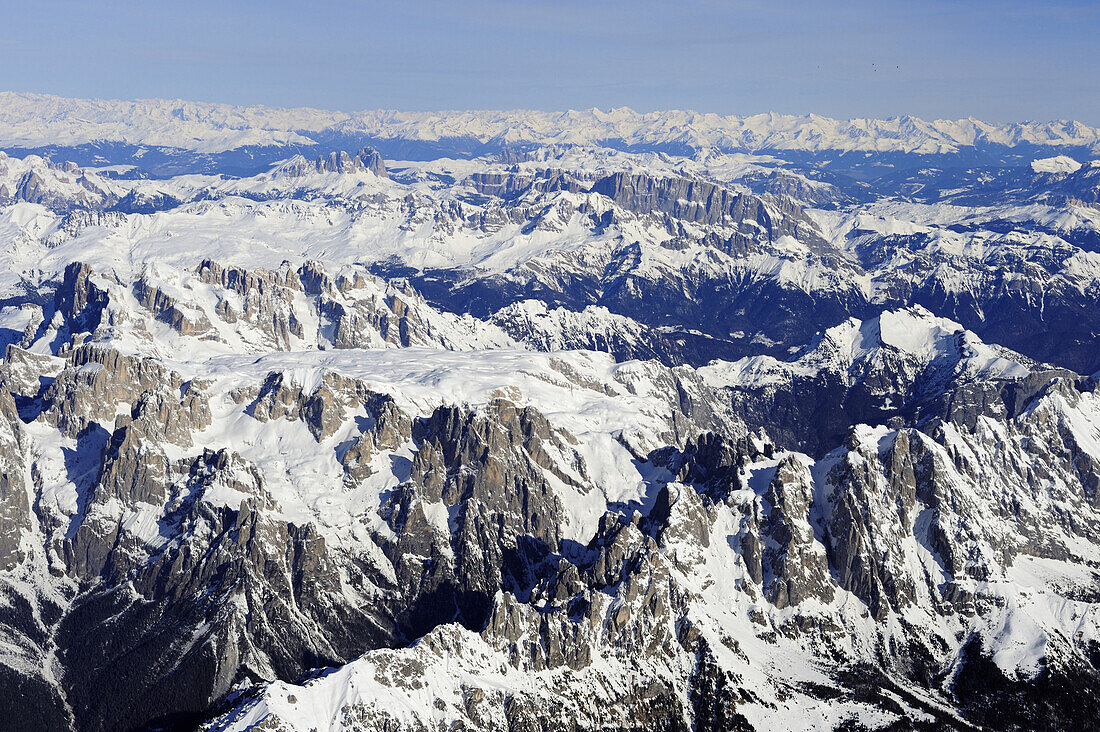 Pala range in winter, with Plattkofel, Langkofel, Sella range, Marmolada range, Zillertal range in background, aerial photo, Dolomites, Venetia, Italy, Europe