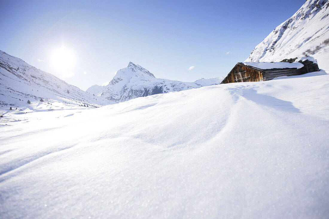 Snow-covered barn, Ballun peak in background, Galtuer, Paznaun valley, Tyrol, Austria