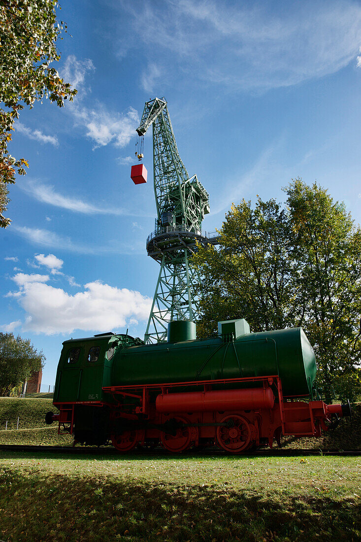 Steam locomotive and assembly crane, Eberswalde Family Garden, Eberswalde, Land Brandenburg, Germany