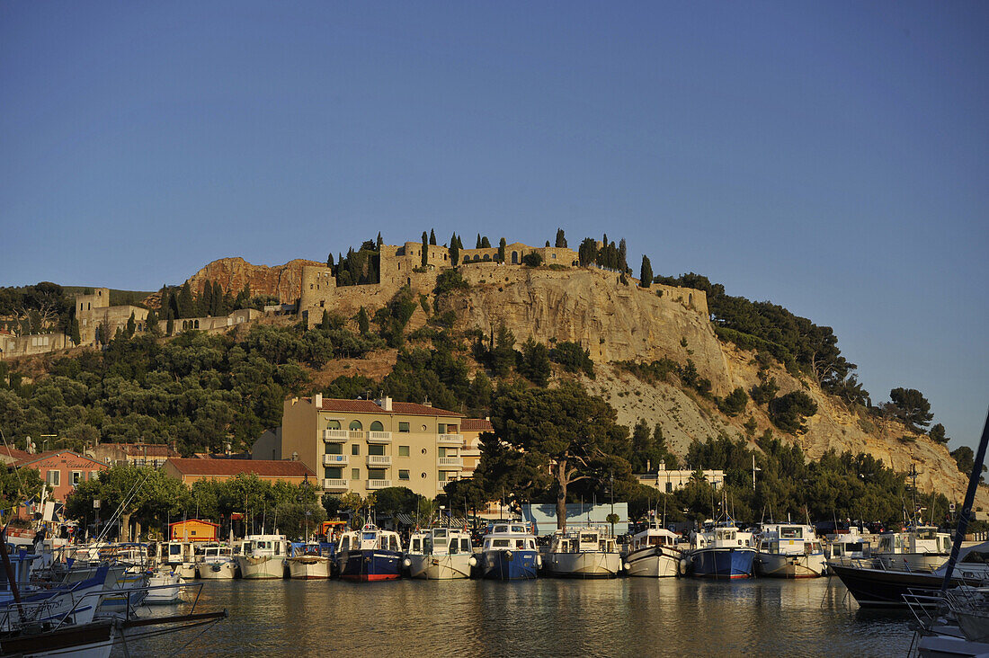 View at boats at harbour and fortress, Cassis, Cote d´Azur, Bouches-du-Rhone, Provence, France, Europe