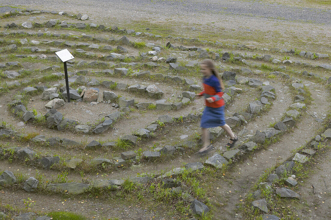 Girl running in labyrinth