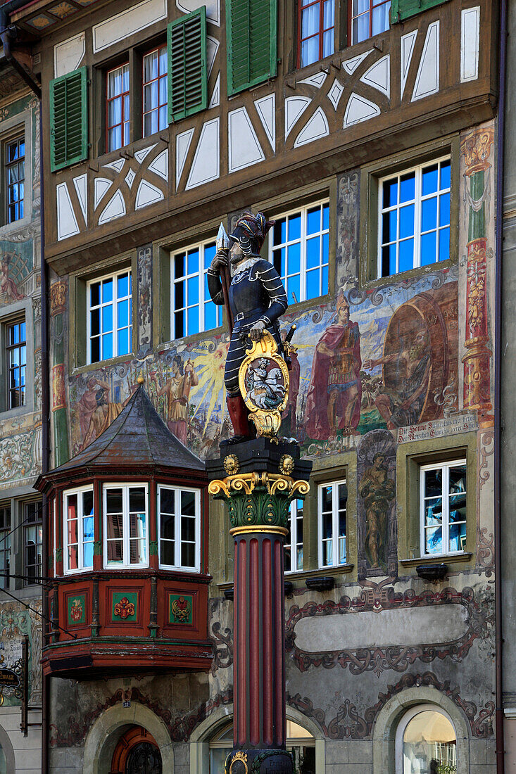 Facades and figure on a fountain at the city hall square, Stein am Rhein, High Rhine, Lake Constance, Canton Schaffhausen, Switzerland, Europe