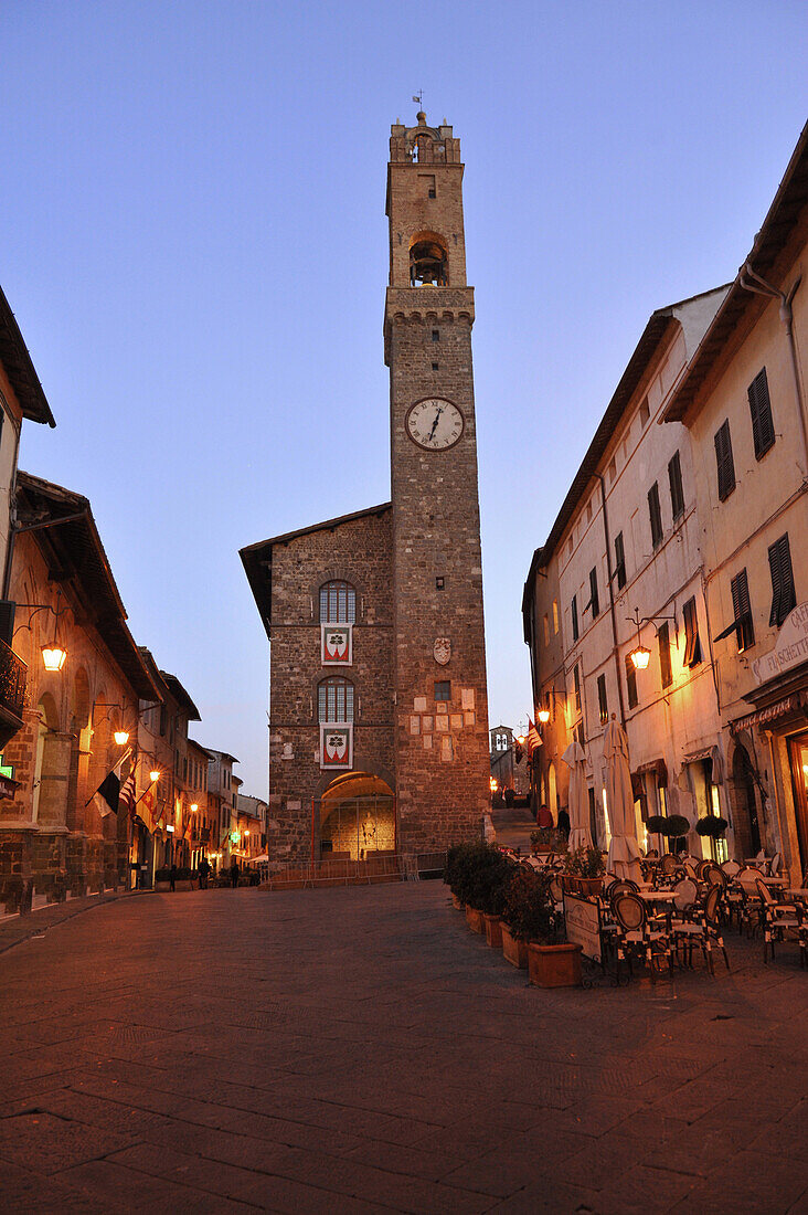 Town hall and street cafes at Piazza del Popolo in the evening, Montalcino, Tuscany, Italy, Europe