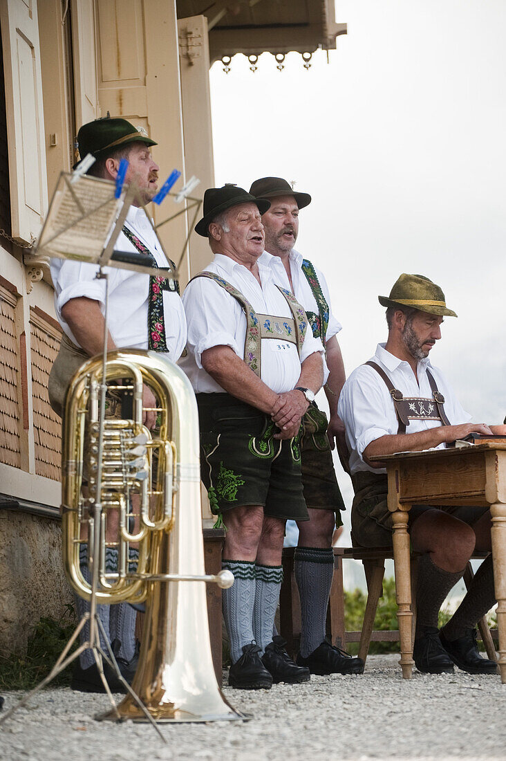 Men singing, King's House on Schachen, Wetterstein range, Upper Bavaria, Germany