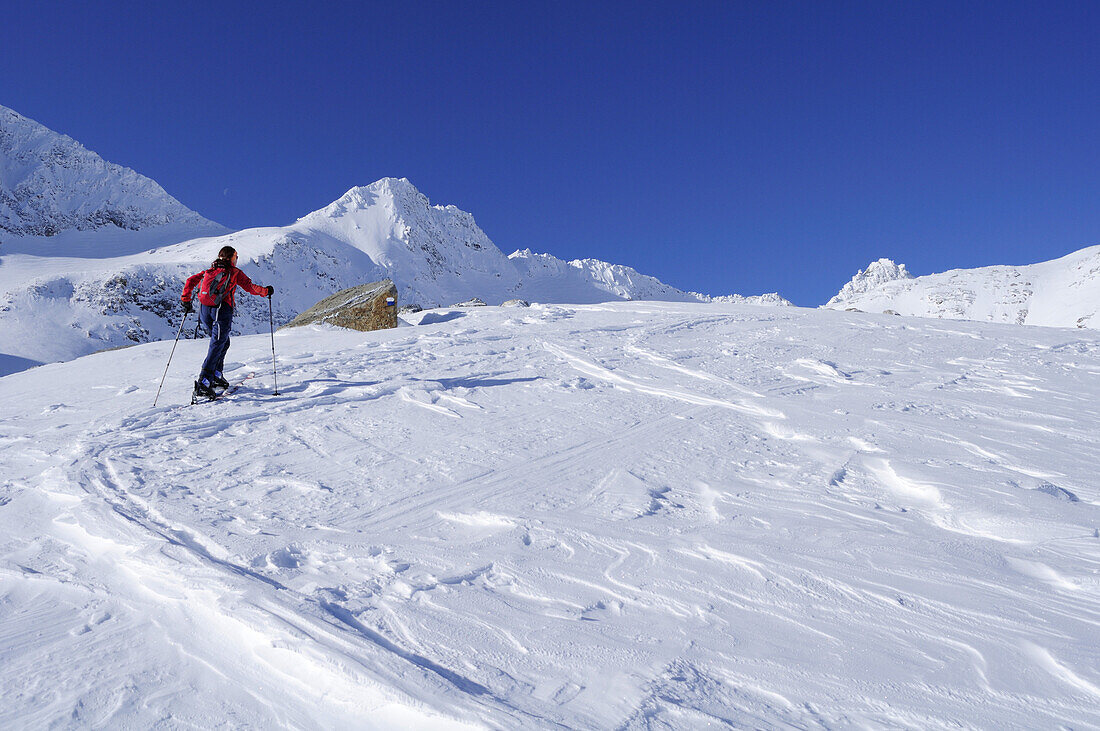 Female backcountry skier ascending to Hoher Sonnblick, Rauris valley, Goldberg mountain range, Hohe Tauern, Salzburg, Austria