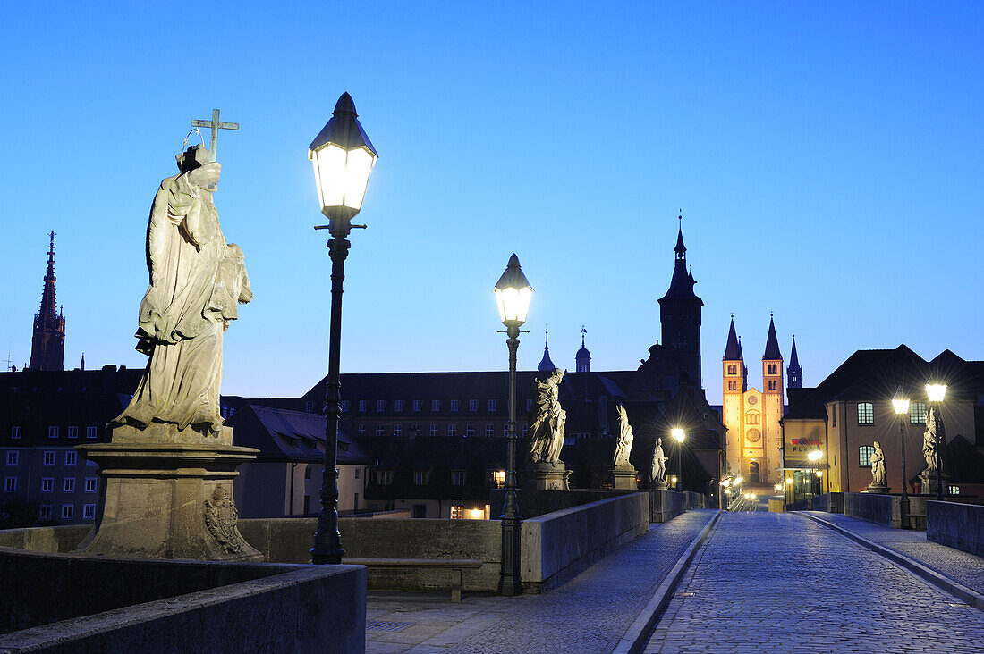 Illuminated bridge Alte Mainbruecke and city of Wuerzburg in the evening light, Wuerzburg, Bavaria, Germany