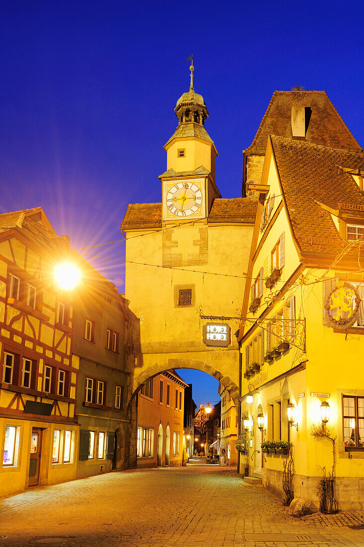 Illuminated city gate Roederbogen and Markusturm tower, night shot, Rothenburg ob der Tauber, Bavaria, Germany