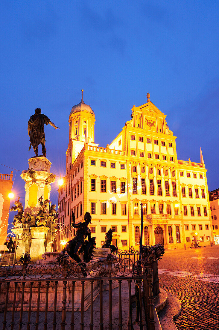 Augustusbrunnen Fountain on Rathausplatz square with illuminated city hall, night shot, Augsburg, Bavaria, Germany