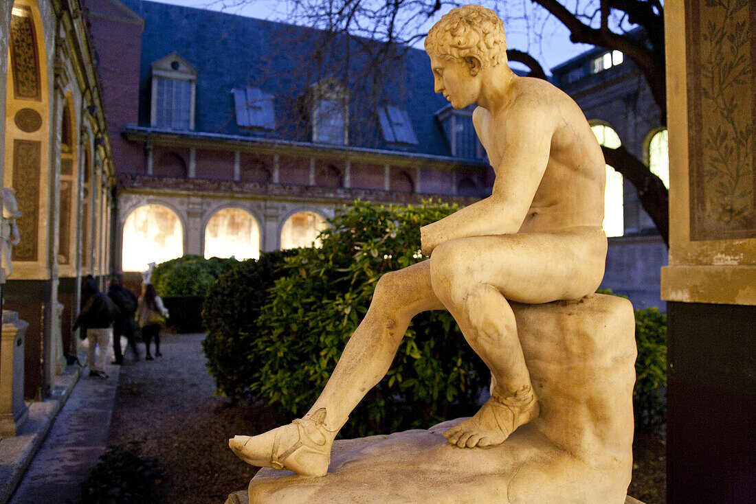 Sculpture of a young man at a courtyard in the evening, École nationale supérieure des beaux-arts de Paris, Paris, France, Europe
