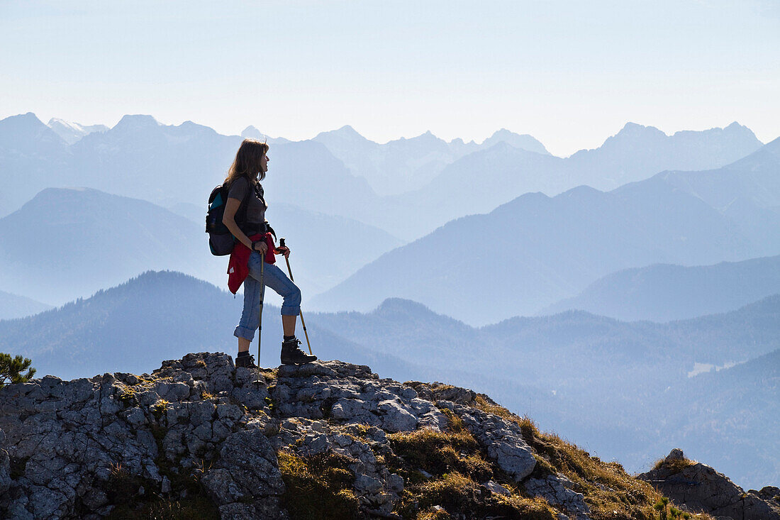 Woman mountain hiking on Brauneck, Karwendel mountain range, Upper Bavaria, Germany