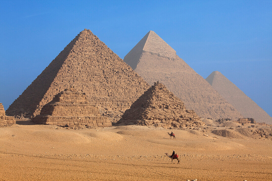 Pyramids of the Queens in the front and the pyramids of Menkaure, Khafre and Khufu (from left), Giza, Cairo, Egypt, Africa