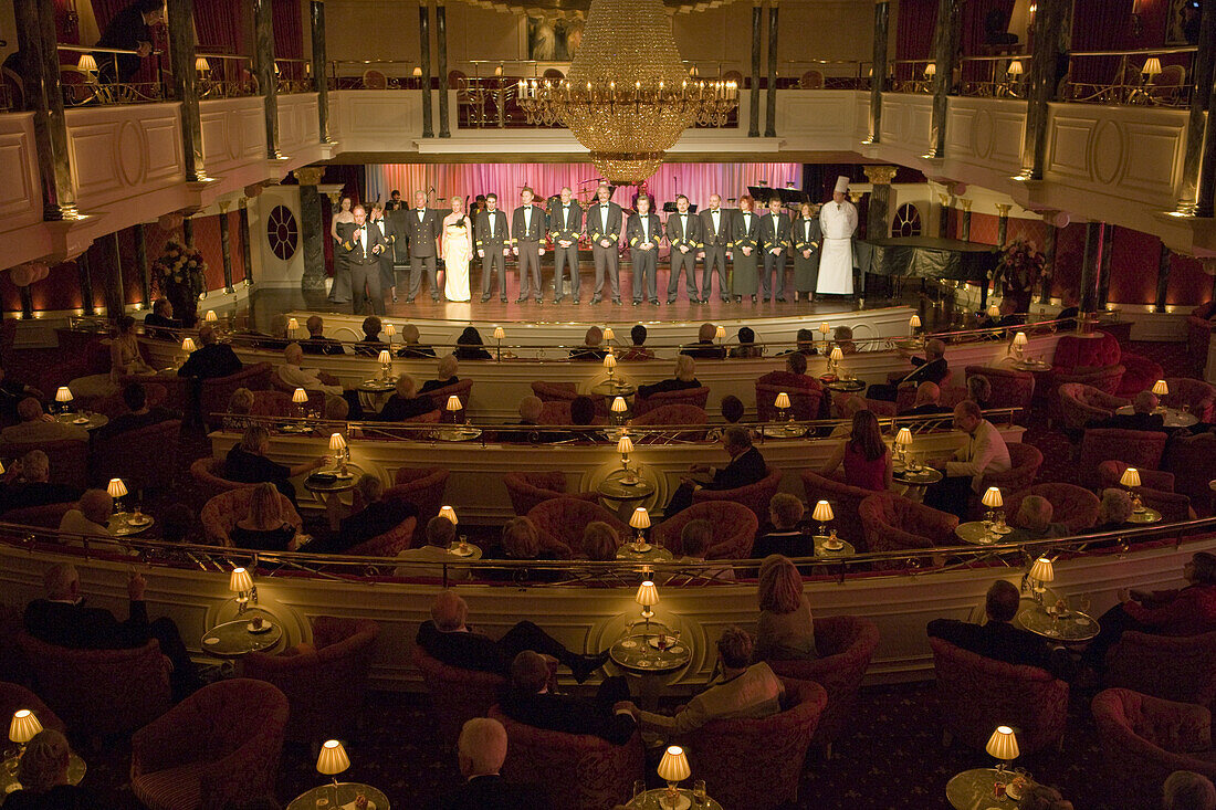 Captain Andreas Greulich introduces his officers at Kaisersaal aboard cruiseship MS Deutschland (Deilmann Cruises), South Pacific Ocean, near Chile, South America, America