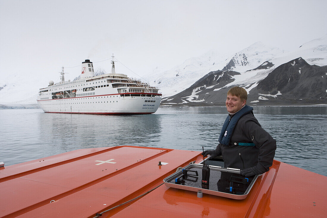 Safety officer Marc-Dominique Tidow aboard tender boat from cruiseship MS Deutschland (Deilann Cruises), False Bay, Livingstone Island, South Shetland Islands, Antarctica