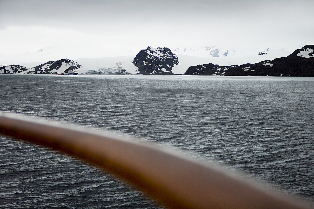 Railing of cruiseship MS Deutschland (Deilmann Cruises) and glacier, False Bay, Livingstone Island, South Shetland Islands, Antarctica