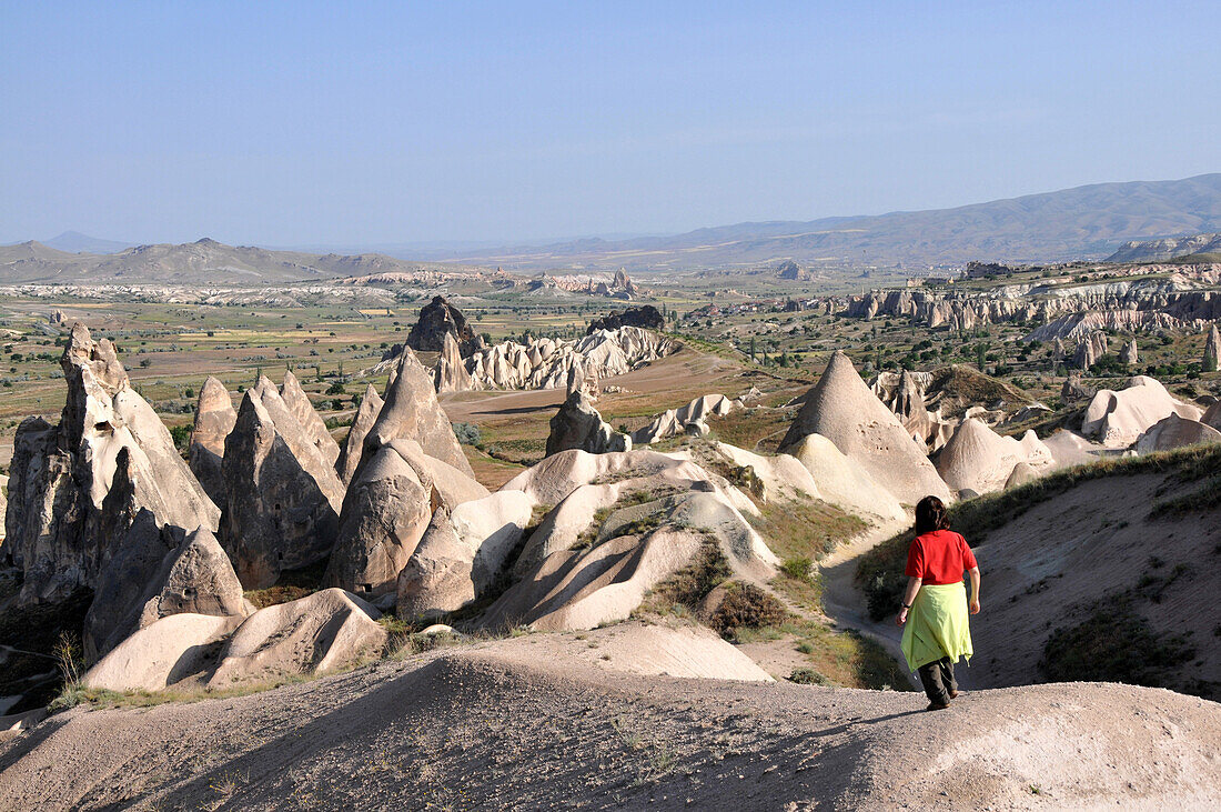 Women is hiking in the valley of Göreme, Cappadocia, Anatolia, Turkey