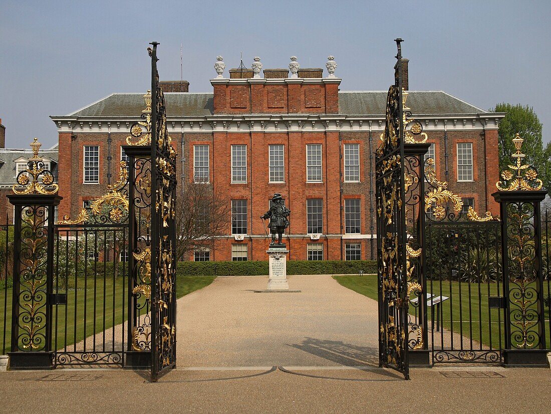 View through a gate onto Kensington Palace, England, Great Britain, Europe