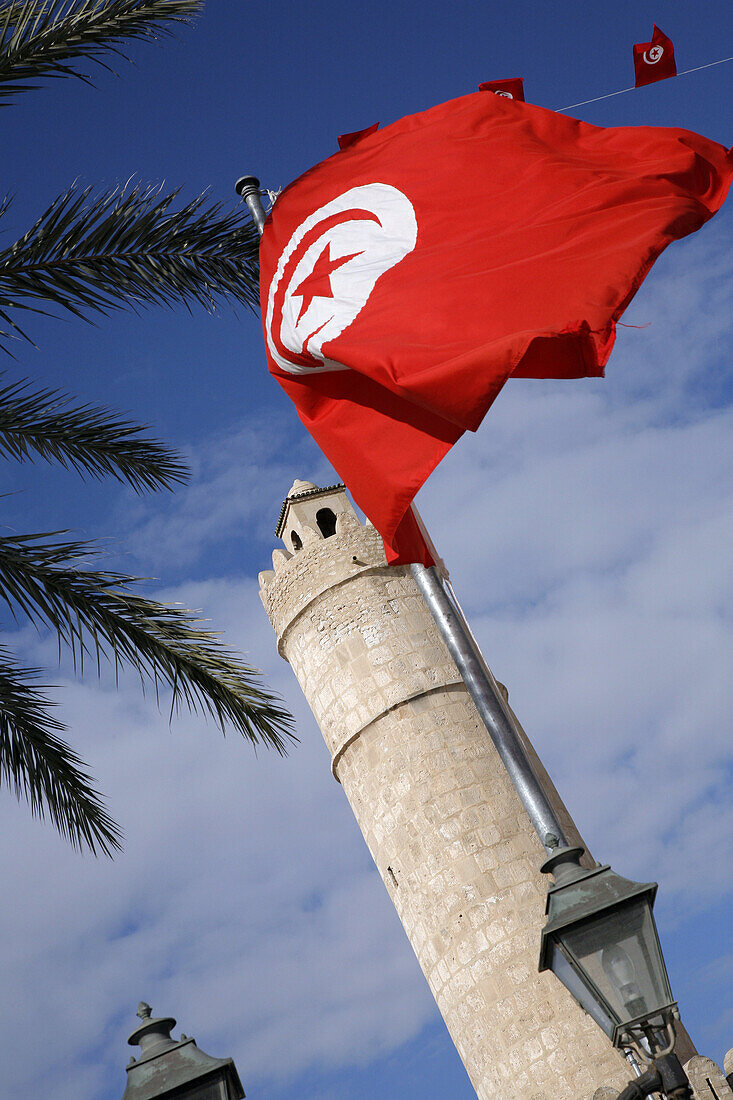 The tunisian flag in front of Sousse Ribat, Tunisia. It the most famous and wellknown ribat in Tunisia. It was built 787, 821 AD.