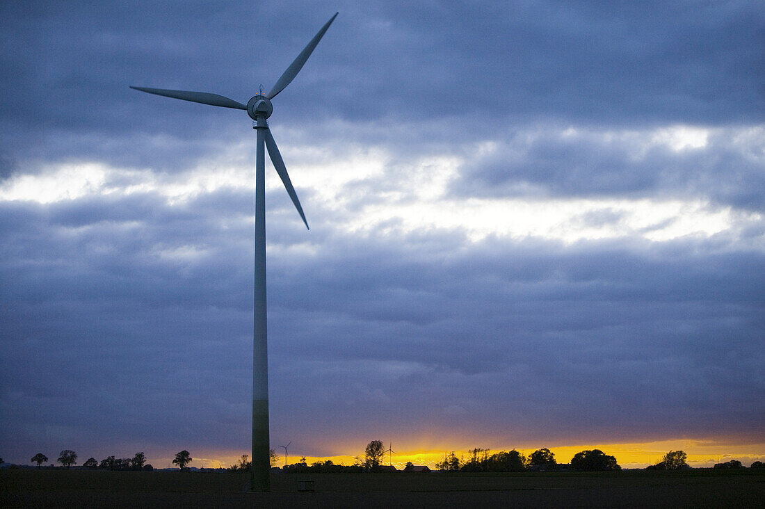 Wind power stations in sunset