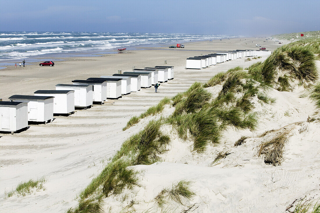 White bathing huts on the beach, Jutland, Denmark