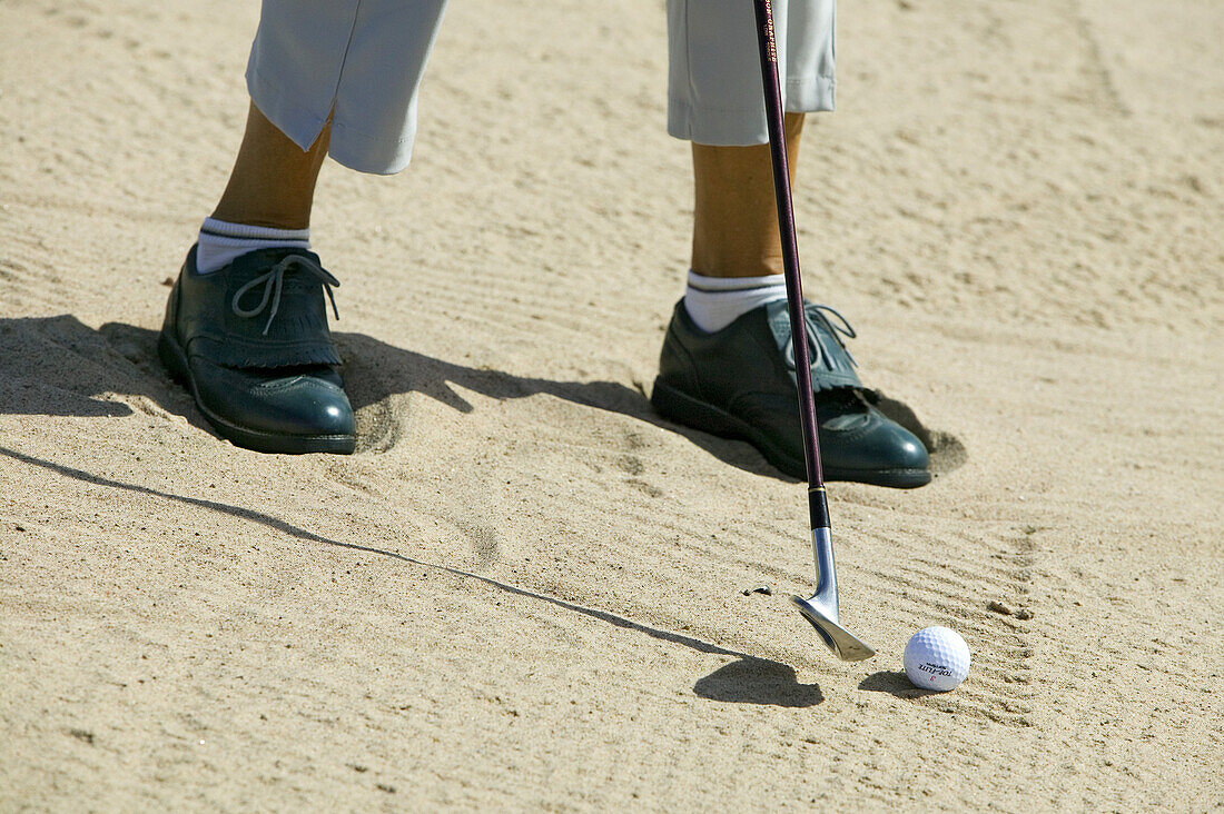 Golf player in the bunker