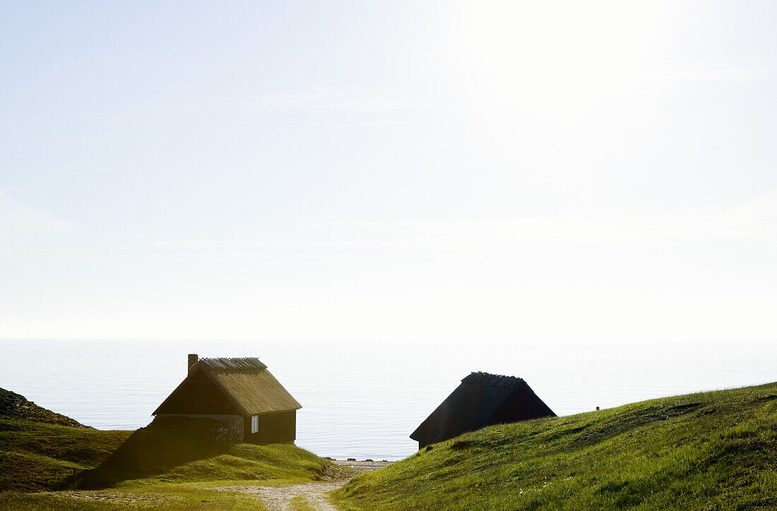Old fishing huts at a steep, Haväng, Skåne, Sweden