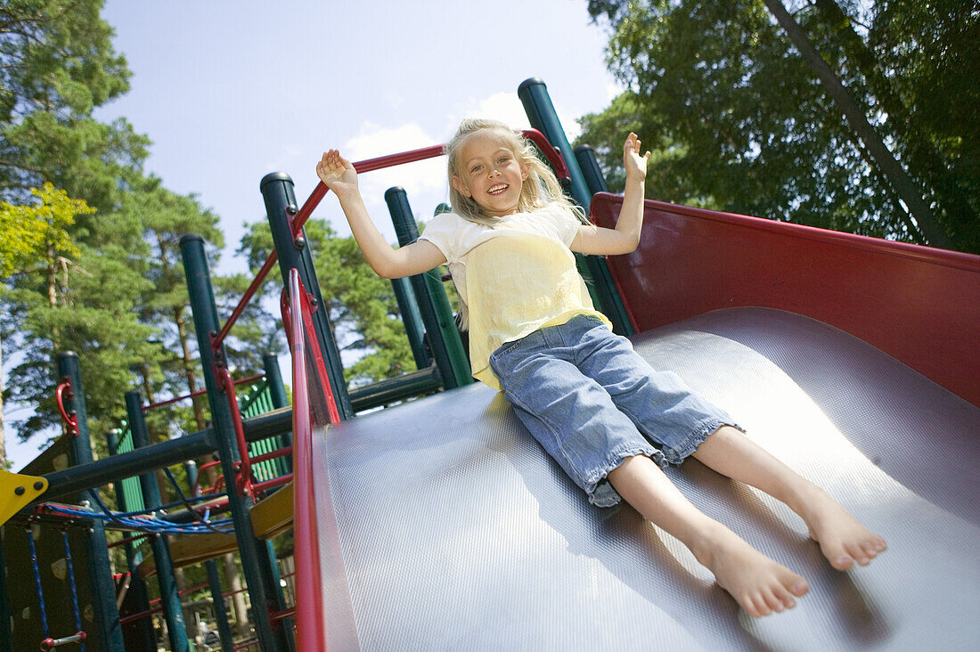 Girl on a playground in Hembygdsparken, Ängelholm, Skåne, Sweden