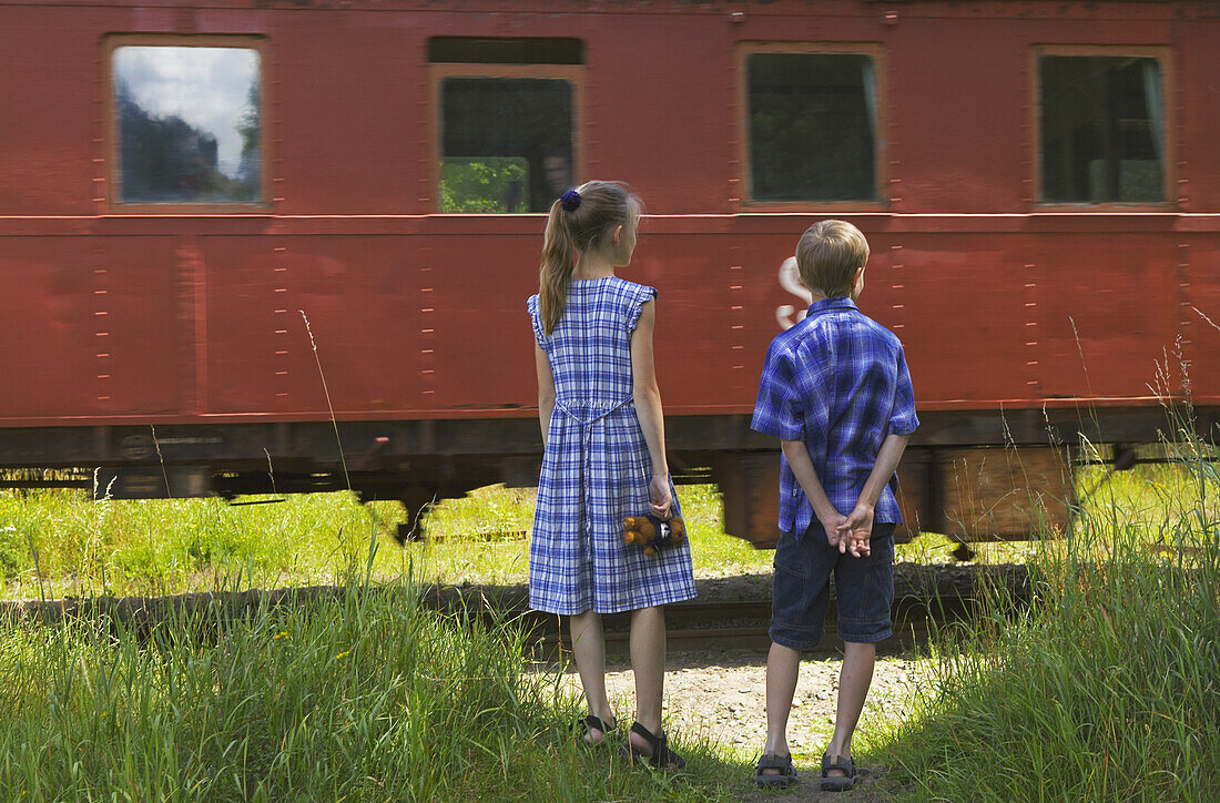 Children watching train passing