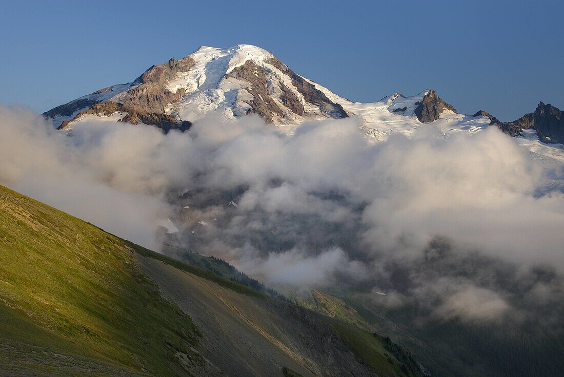 Clouds dissipating in the evening around Mount Baker elevation 10,778 feet 3,285 m  Seen from Chowder Ridge, Mount Baker Wilderness Washington USA